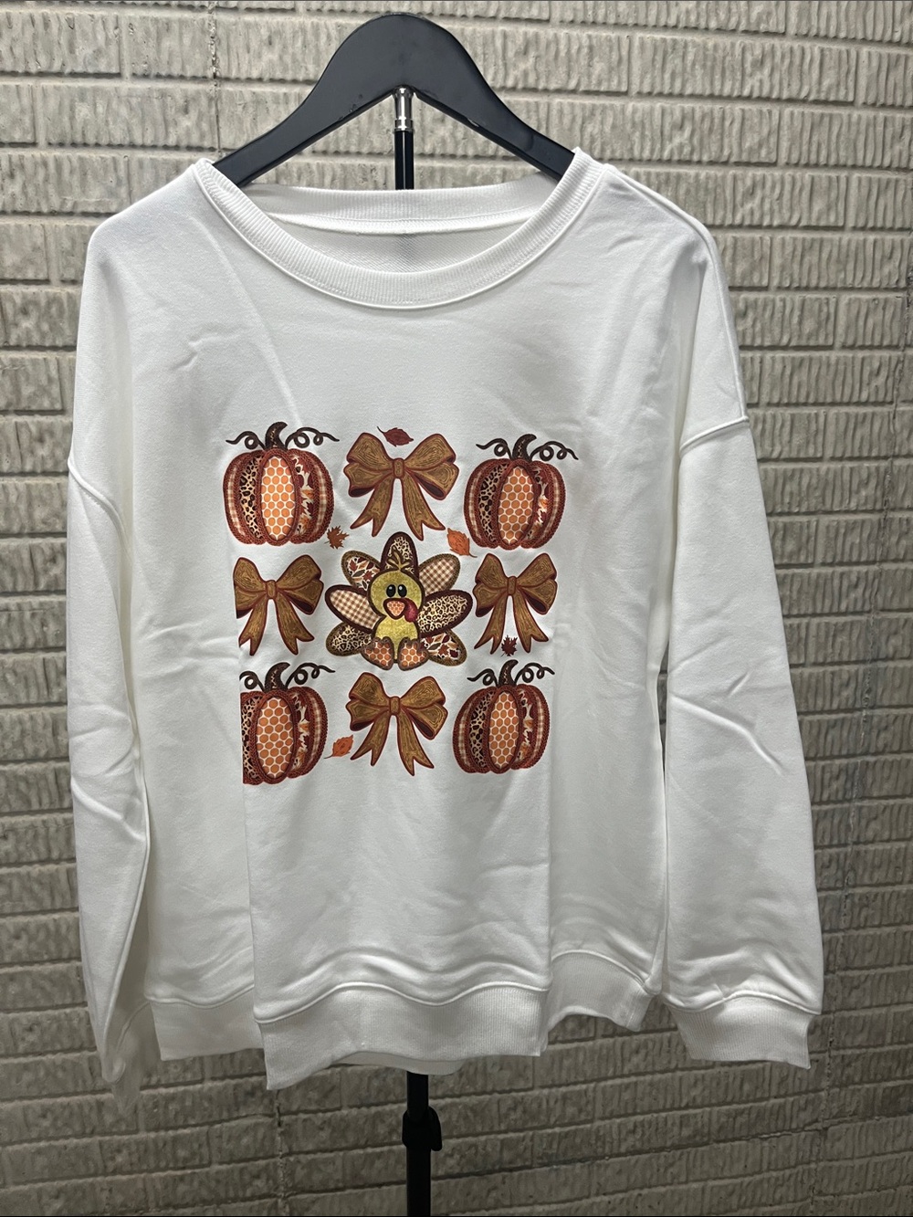 White Women's Pullover Sweatshirt with Fall Pumpkin & Bow Graphic
